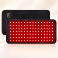 Glambori red light therapy pad, front panel lit and back showing the control button and fastening patch